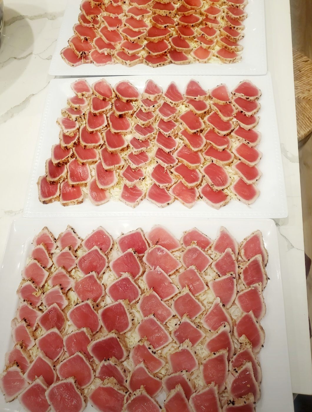 Platters of thinly sliced ahi