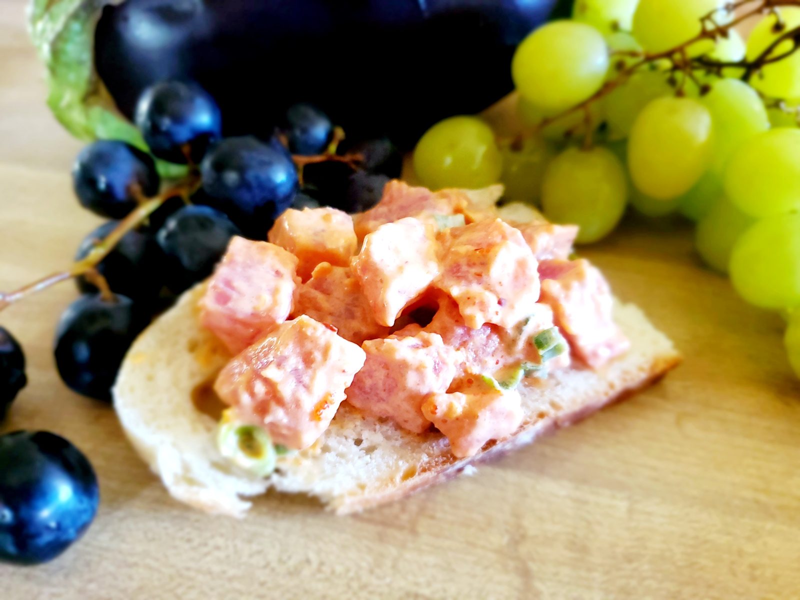 Poke on toasted bread with grapes