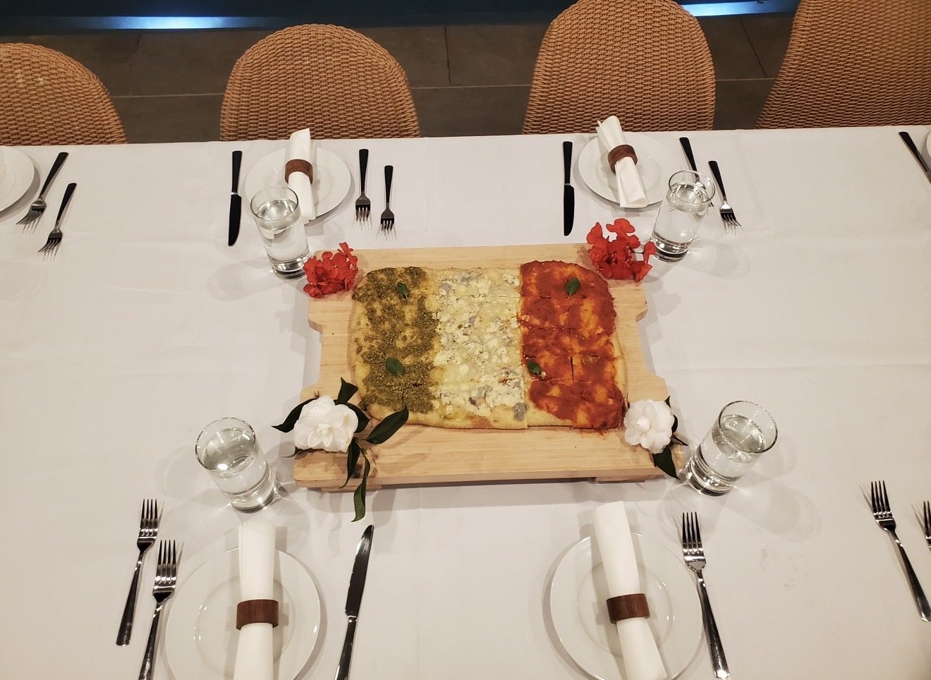 A table set with a tricolore focaccia board in the colors of the Italian flag