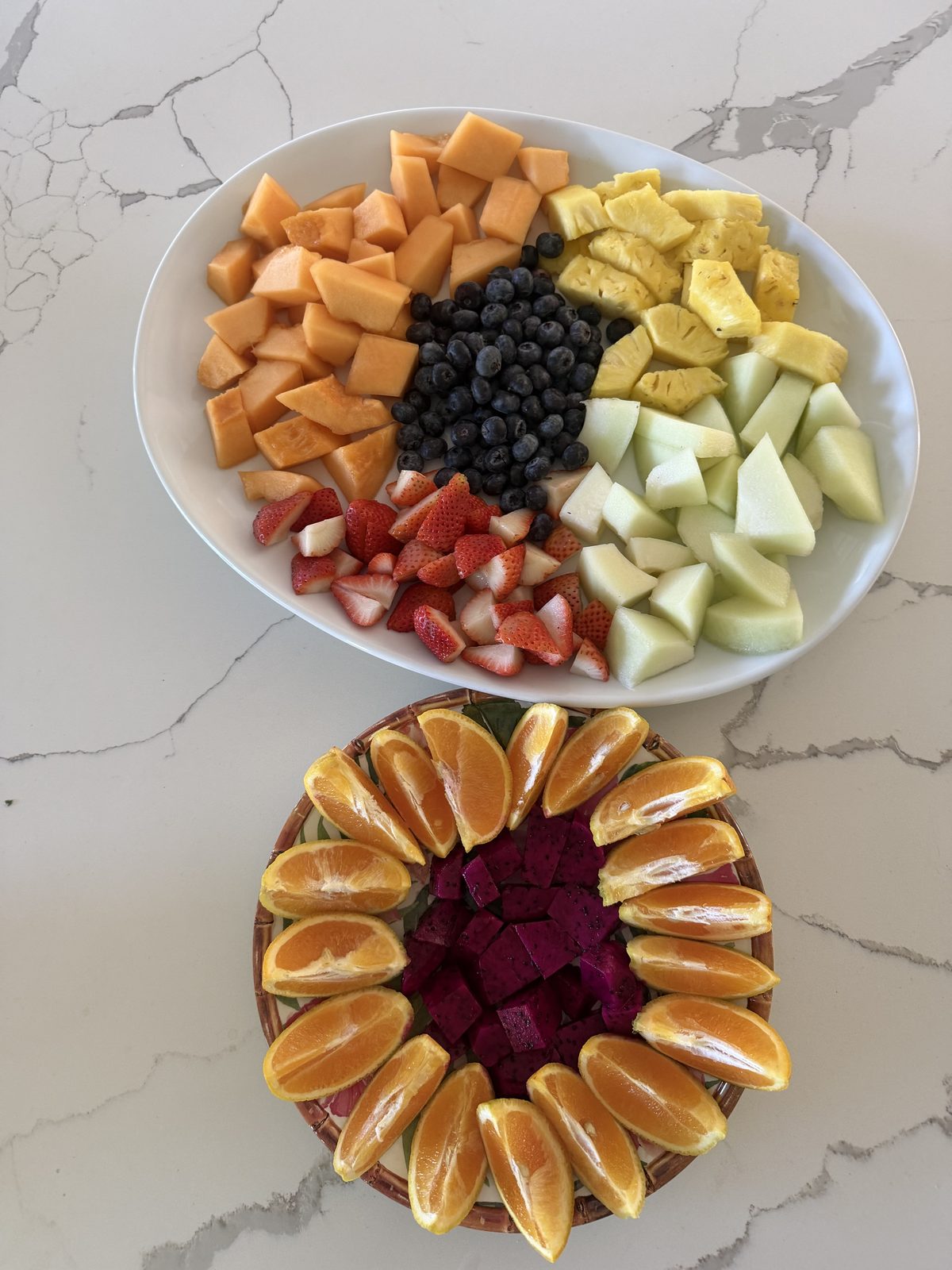 Fresh fruit platter with melon, pineapple, berries and orange